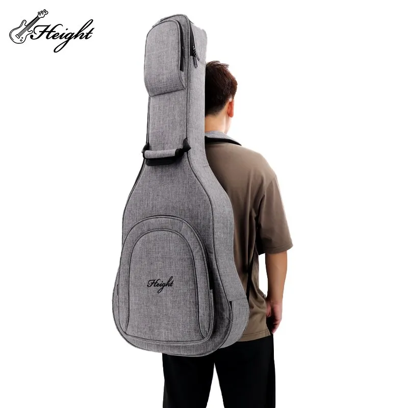A man loaded with guitar bag
